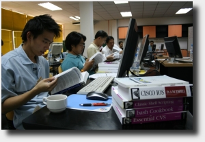 Students enjoy some of the books donated by O'Reilly Media, Inc. during the Network Monitoring and Management Workshop